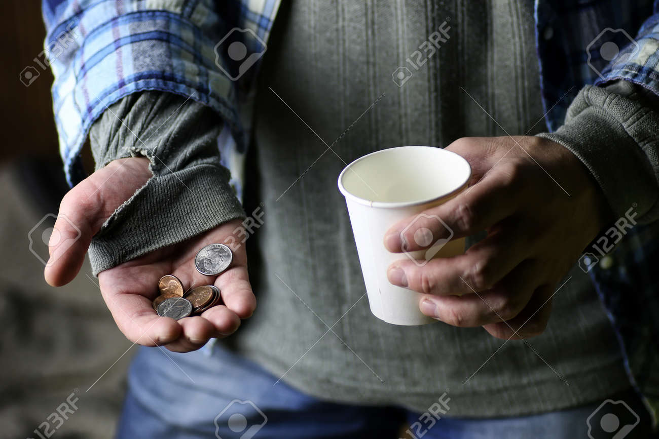 65081310-homeless-man-with-a-sign-asking-for-money.jpg